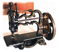  Одна из первых швейных машин 